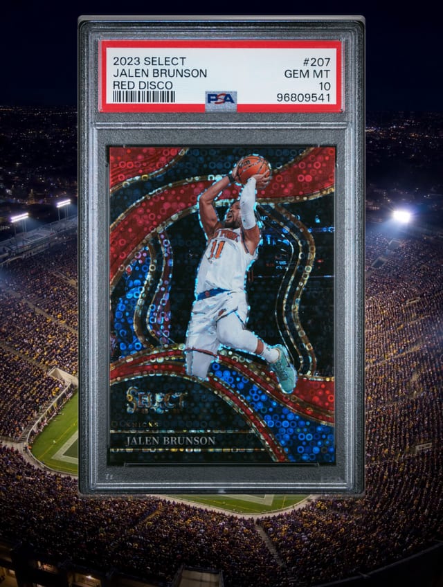 Jalen Brunson PSA 10 basketball slab above a floodlit football stadium.